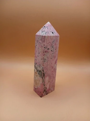 Pointe en Rhodonite – Qualité AA+ sur Fleur de Vie