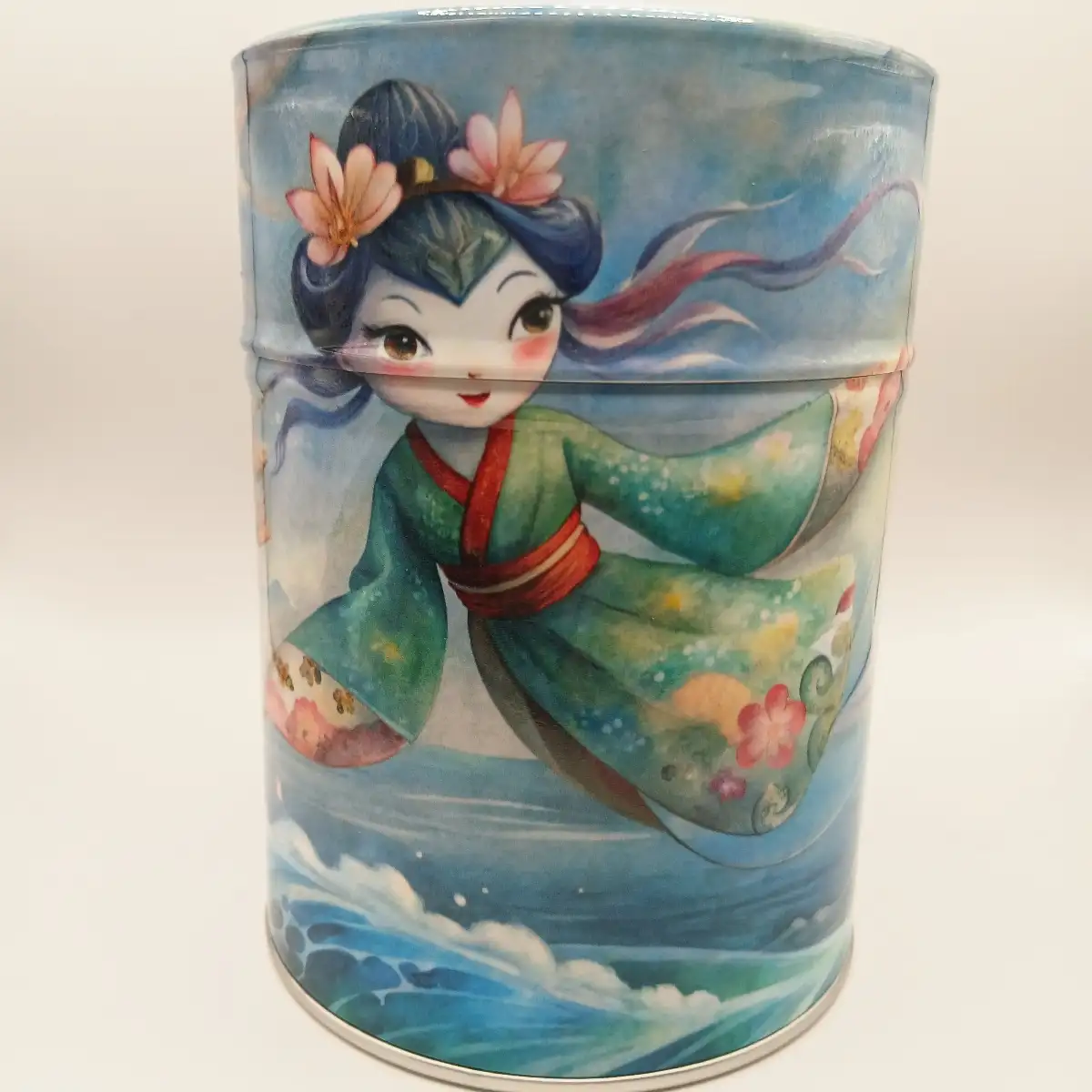 Boîte traditionnelle illustrée Jeune Femme qui danse au-dessus des vagues– 100g